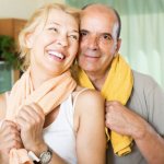 Elderly couple relaxing after sports training